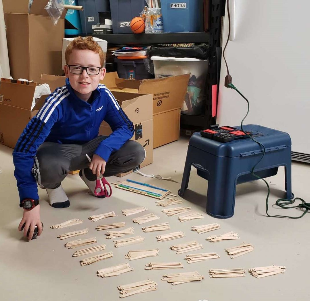 Student building STEM kits